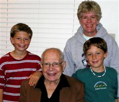Kevin, Eve and Scottie pose with Fred in October 2004