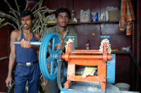 Sugar cane juice makers. They crush a bit of lemmon and a lot of sugar cane while you watch and then drink in a shared glass.